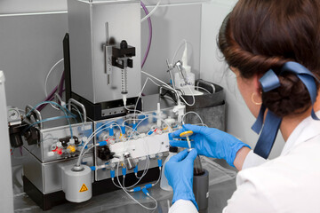Technician preparing chemical radioactive contrast agent medicine for radiology and nuclear...