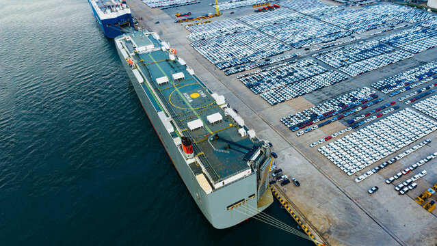 Aerial view ro-ro ship, Cargo ship transportation of business logistic sea freight, New Cars produced by year up in the port for Cargo ship and Cargo import-export around in the world