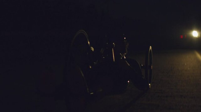 Para Athlete cycling at night