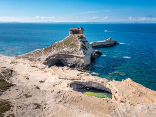 Aerial view of Grotte de Saint Antoine and Capo Pertusato on the Mediterranean coast near Bonifacio...