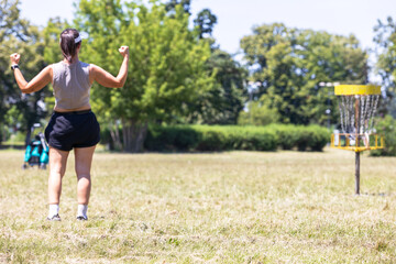 Woman playing flying disc golf sport game
