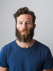 Obraz premium Close-up portrait of a bearded man, showcasing contemporary masculinity. Ideal for themes of modern style, men's fashion, and portrait photography