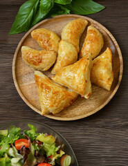 traditional oriental food samsa with sauce