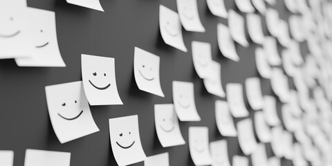 Many white stickers on black board background with smile with winkle symbol drawn on them. Closeup...