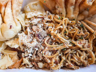 Mie Goreng ala Mie Gacoan is homemade fried noodle topping with chicken shraded and fried dumpling.