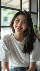 A striking portrait of a young Asian woman wearing an white t-shirt, exuding natural beauty and contemporary style.