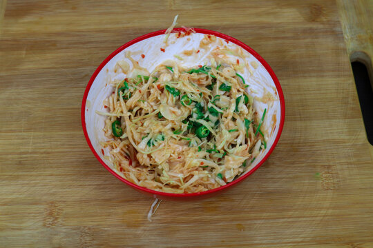 Spicy cabbage salad with green chilies in a bowl