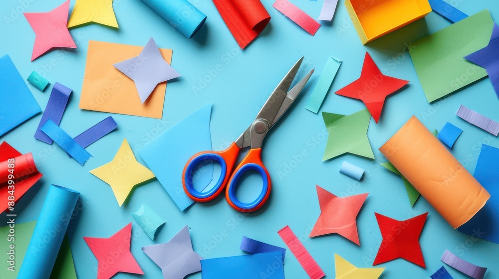 Poster scissors and glue with construction paper shapes.