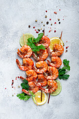 Fried shrimp, without a head, on skewers, shrimp kebabs, with spices, grilled, homemade, without...