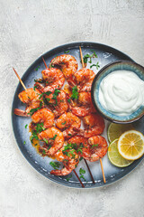 Fried shrimp, without a head, on skewers, shrimp kebabs, with spices, grilled, homemade, without people,