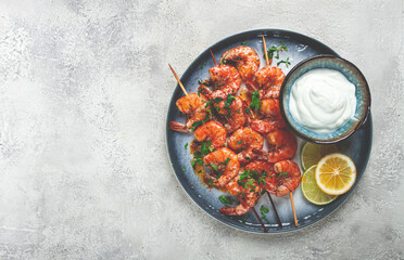 Fried shrimp, without a head, on skewers, shrimp kebabs, with spices, grilled, homemade, without people,