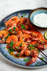 Fried shrimp, without a head, on skewers, shrimp kebabs, with spices, grilled, homemade, without people,