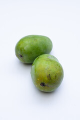 Fresh mango fruit on a white background, highlighting its vibrant yellow color and smooth texture, perfect for food photography and advertising