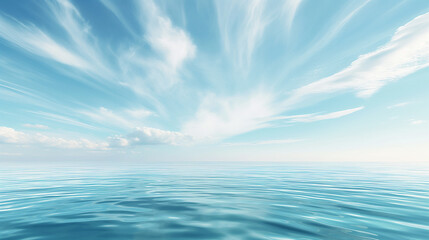 Clear blue ocean with reflections of fluffy white clouds in the sky.