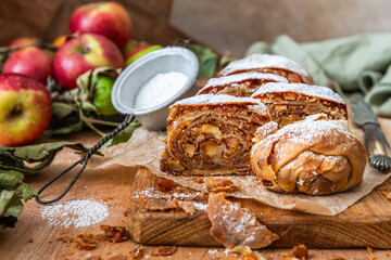 Homemade traditional Apple strudel on a wooden background