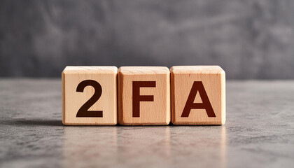 Wooden cubes with abbreviation 2FA, cement background. Two-Factor Authentication. Online security