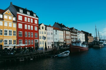Buildings along the Nyhavn waterfront in Copenhagen, Denmark on a sunny day