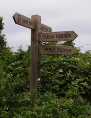 signs on a coastal path 