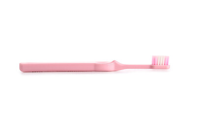 Pink toothbrush on white background