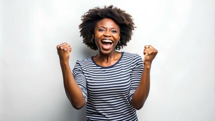 Excited black American lady eager for a yes stands over a white background. Joy of Victory American Lady Shaking Fists
