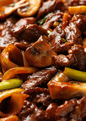 Beef Mushroom Stir Fry with ginger and garlic in a white plate