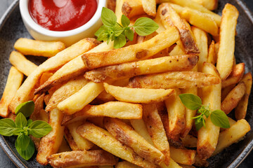 Homemade French fries with ketchup, homemade roasted in the air fryer.