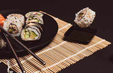 Sushi collection, isolated on black background, medium sushi set on black background, Sushi on a black background