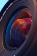Professional Camera Lens Close-Up with Colorful Reflections and Bokeh in 4K