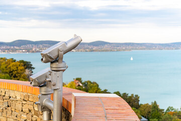 Binoculars displayed for tourists at a scenic lookout point by Lake Balaton in Hungary	