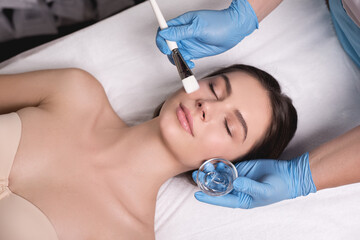 Indulge in a luxurious facial treatment at a spa administered by a skilled skincare specialist