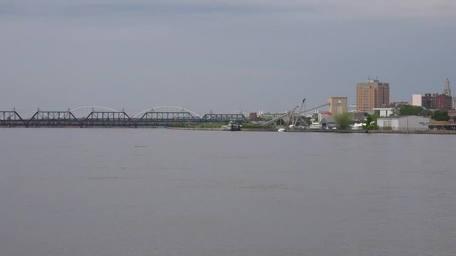 IOWA - 6.24.2024 - Great water-level view of Davenport, Iowa and bridges over the Mississippi River.