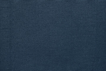 Dark blue cotton drill fabric pattern close up as background	
