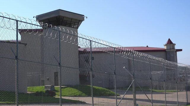 IOWA - 6.28.2024 - A guard tower sits between the Iowa State Penitentiary and a barbed wire fence.