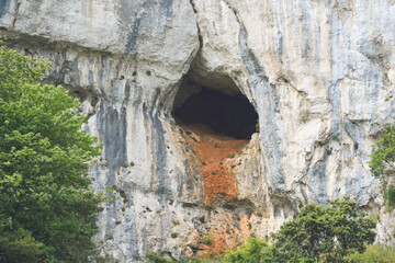 Exit from an underground grotto caused by water in a limestone wall