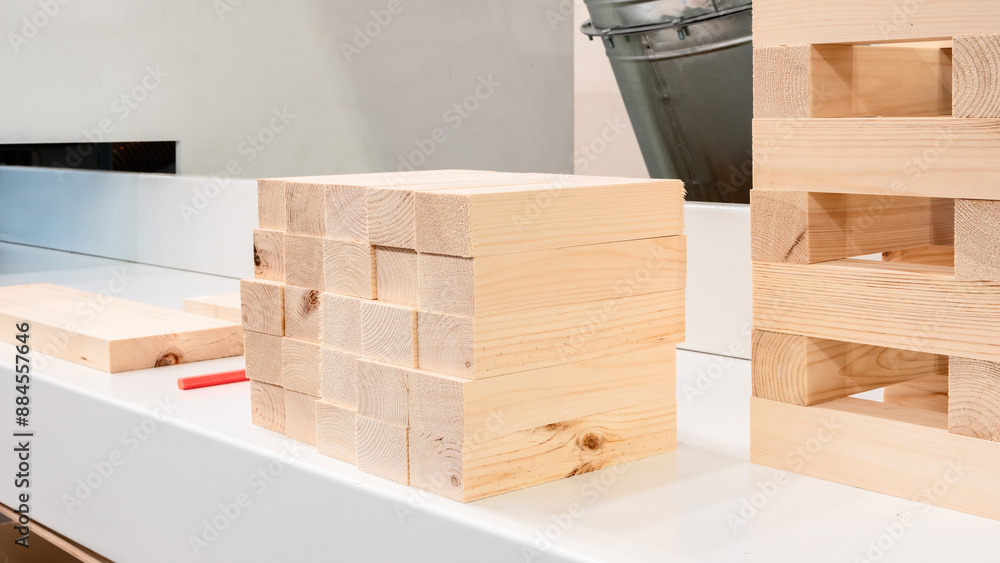 Poster A stack of wood blocks and a red crayon on a table