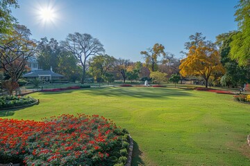 Obraz premium Expansive park with blooming flower beds and manicured lawns sunny outdoor scene colorful garden landscape