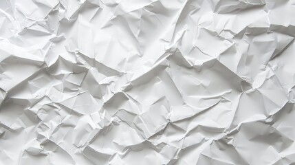 Fototapeta premium The crumpled texture of white paper serves as a versatile background for various purposes.