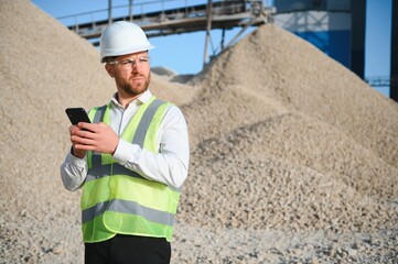 An engineer at a crushed stone or gravel plant. Stone mining