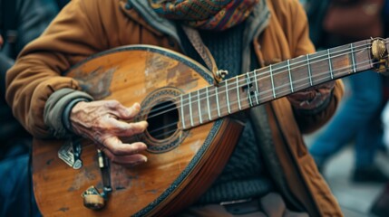 A close-up of a street musician playing an instrument. 