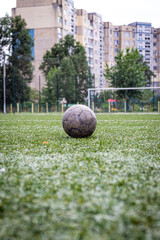 Old dirty ball on green soccer field. Team sport, football match at the stadium © Vladyslav Sydorenko