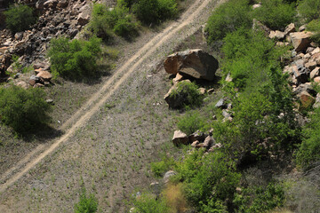 Dirt road through rocks in the mountains