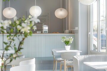 Fototapeta premium Interior of a modern cafe with a white color scheme and natural light streaming through the windows