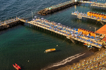 Sorrento, Italy - June 20, 2024: Beautiful coastal view of a marina in Sorrento, Italy with boats,...