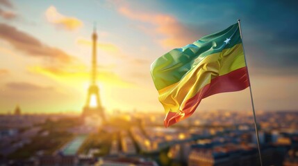 Ethiopian Flag Waving in the Wind, with Blurred Eiffel Tower and Cityscape in Background at Sunset