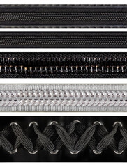 Seamless isolated png photo of black and white colored zippers and corset braid on transparent background.