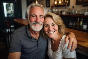 Fototapeta premium Smiling portrait of a senior couple small business owners