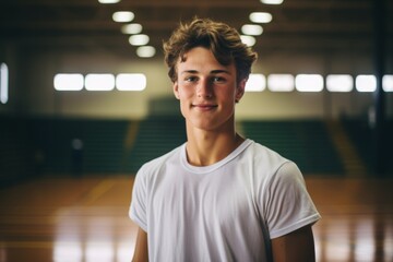Fototapeta premium Portrait of a smiling teenage male Caucasian basketball player