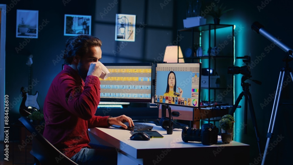 Aufkleber photographer feeling tired from using photo editing software on pc display, drinking cup of coffee. 