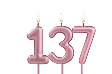 Lit birthday candle - Candle number 137 on white background
