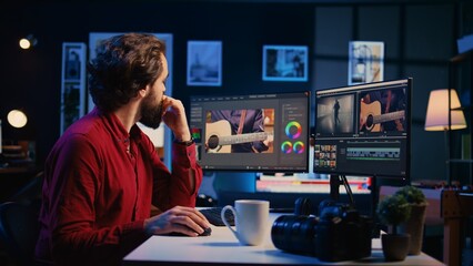 Video editor arranging recorded stock clips into seamless whole in creative media studio using...